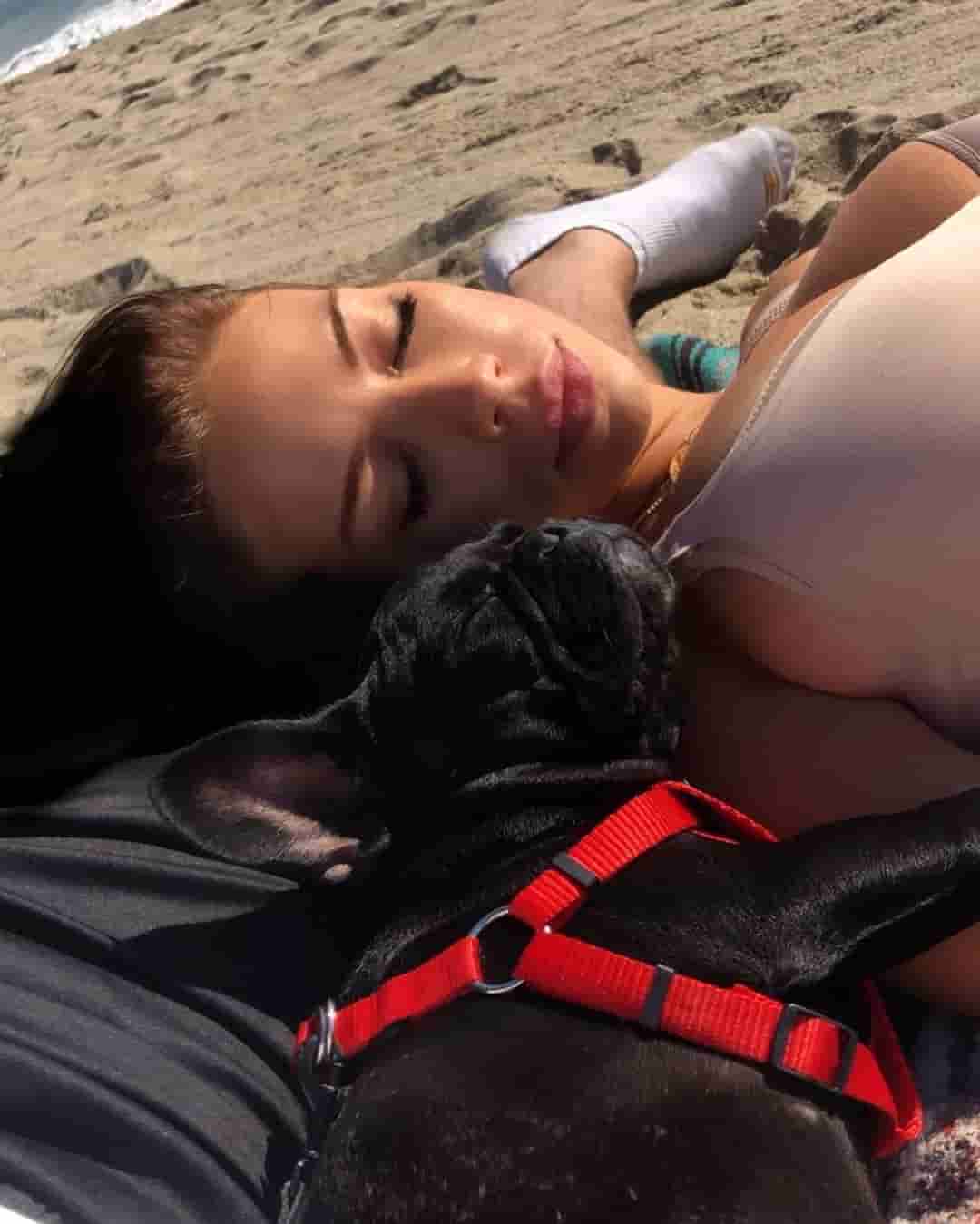 Izabela Izycka having a great time on the beach with her pet Bentley,