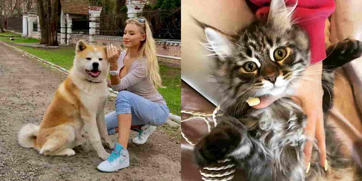 Ekaterina Novikova with her pet dog and cat.
