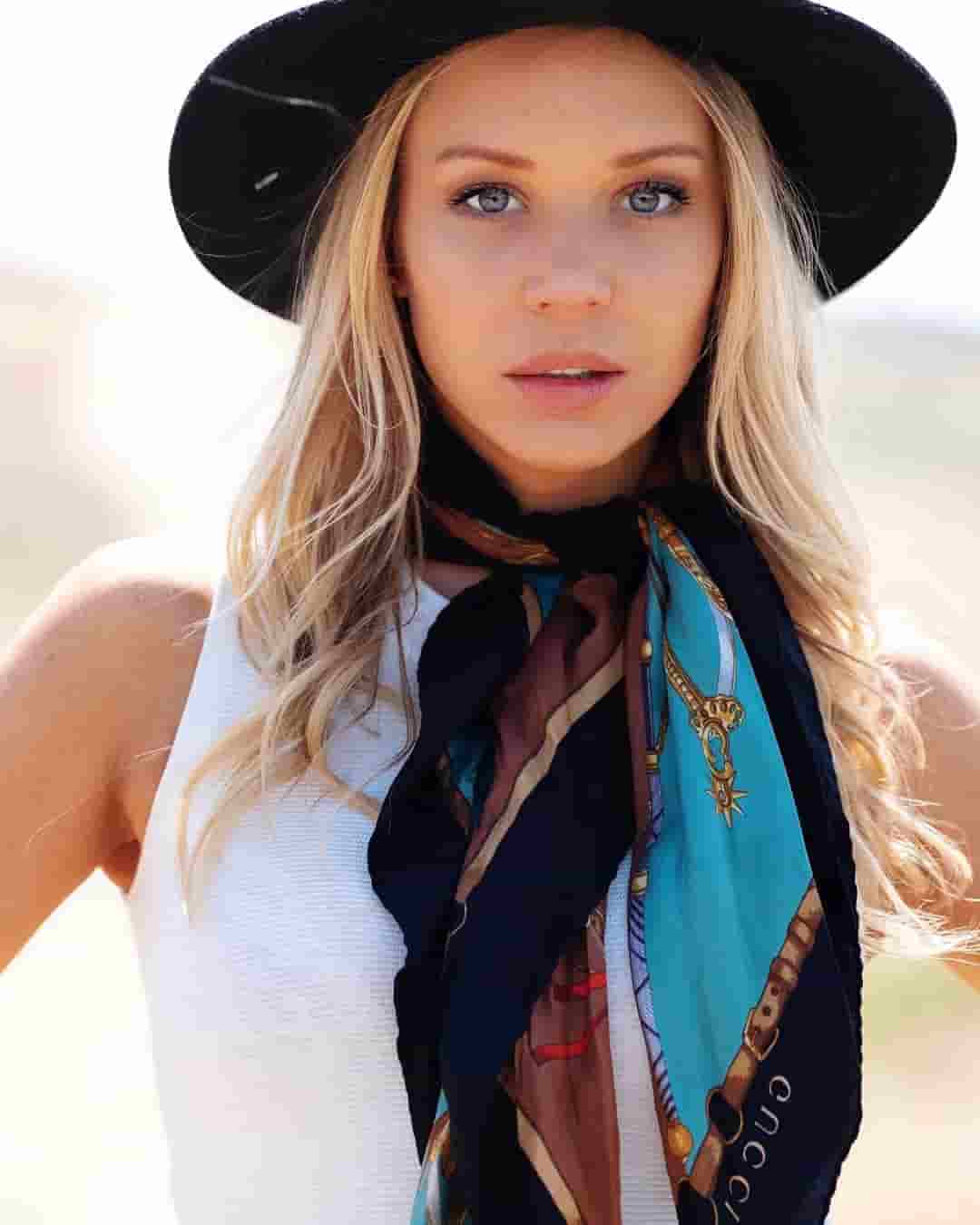 Tara Holt looking stunning in her black hat and scarf.