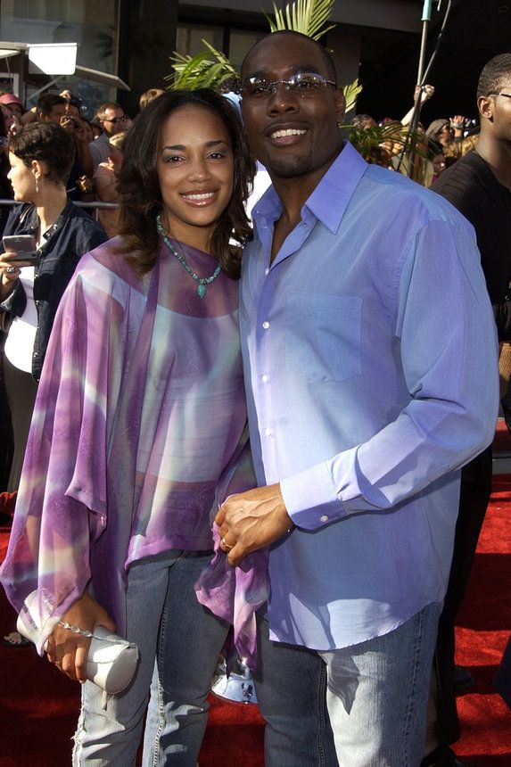 Mr. and Mrs. Chestnut at a red carpet event in 2015 in purple attire
