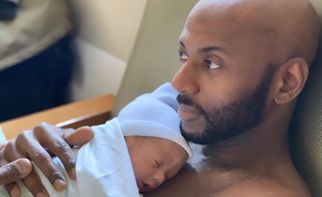 52-year-old first-time dad Malco with his newborn son, "Brave"