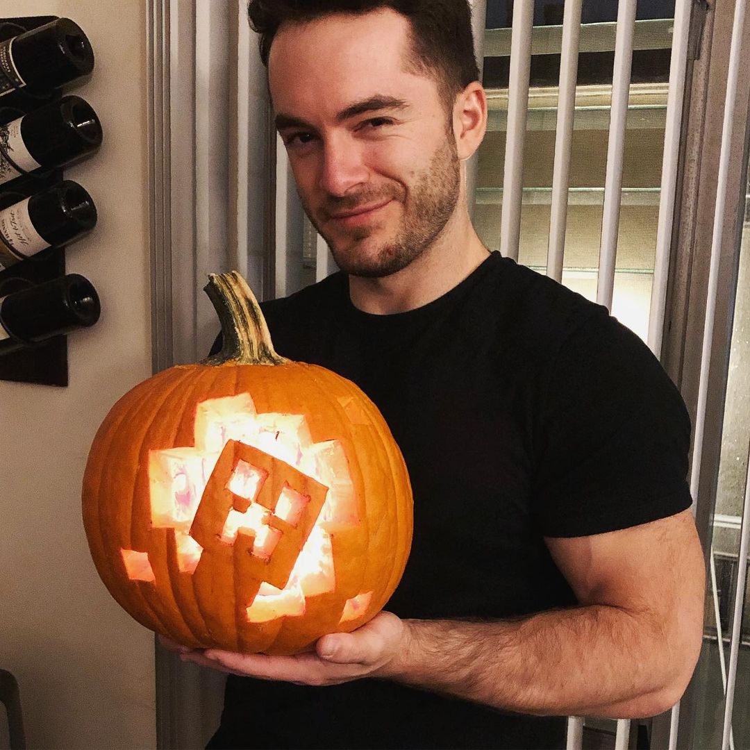 Jordan Maron holding a spooky pumpkin 
