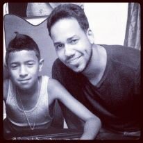 Alex Damian Santos with his father  Romeo Santos.