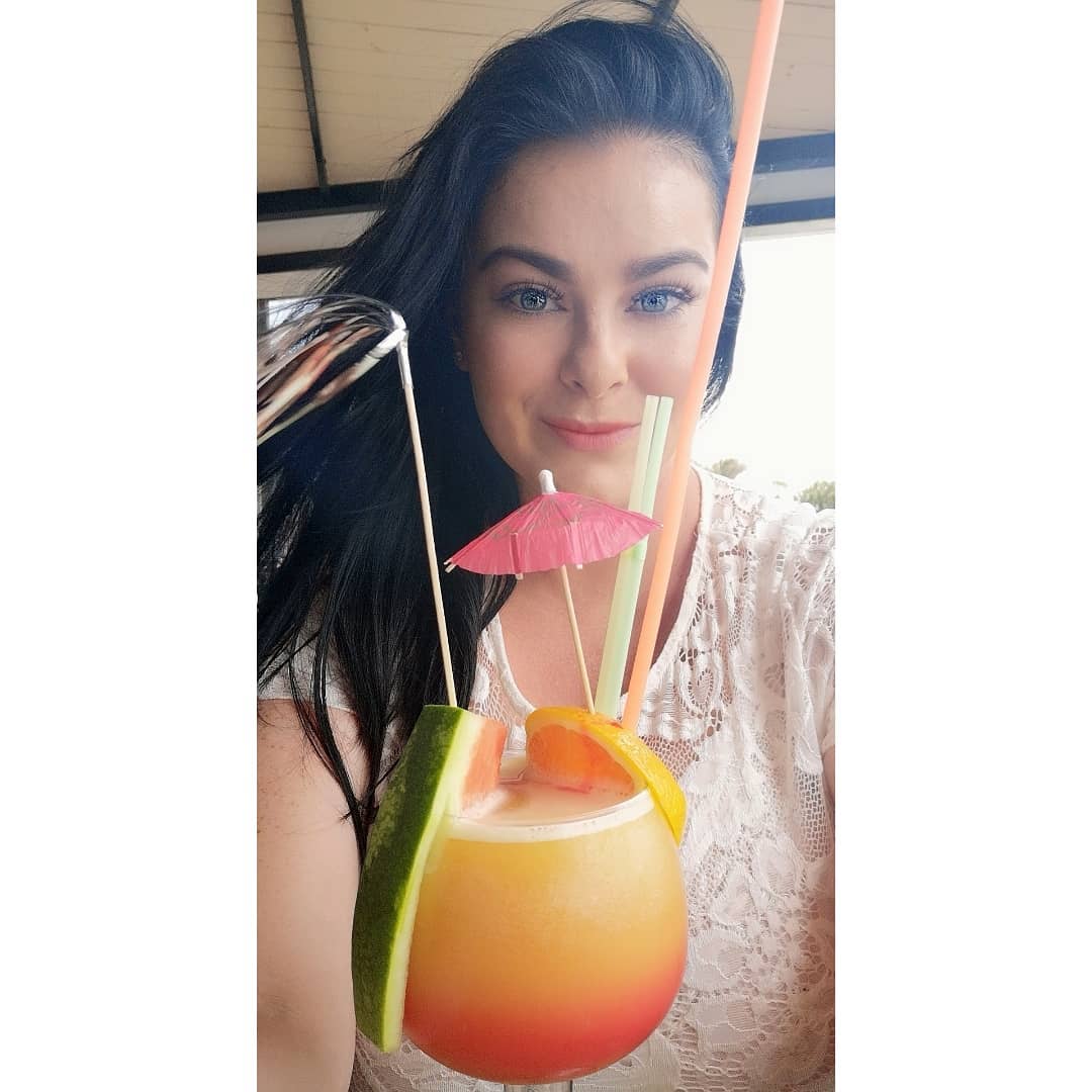 Karla James posing with her drink.