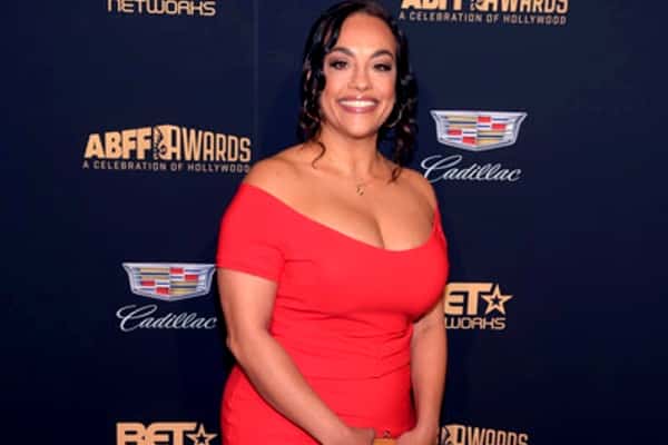 Tomica Wright at an Event in a red dress.